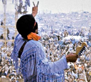 Jimi Hendrix playing at woodstock 1969