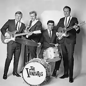 The Ventures band posing with instruments