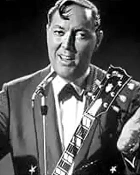 Bill Haley singing with guitar