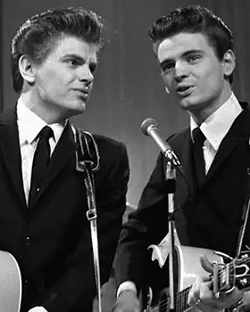 The Everly Brothers singing on stage