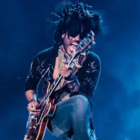 Lenny Kravitz playing guitar