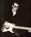 Buddy Holly playing guitar