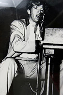 Jerry Lee Lewis singing at piano