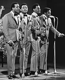 The Four Tops singing on stage