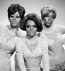 The Supremes posing in classy dresses