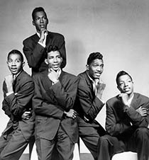 The Temptations posing in suits